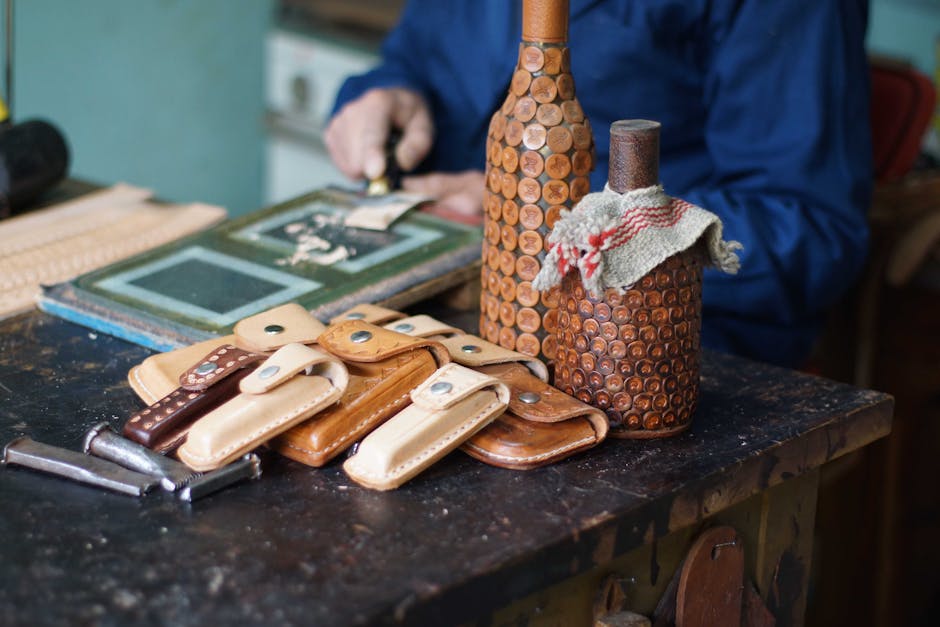 Close-up of artisan leathercrafting with handmade leather products in a traditional workshop.