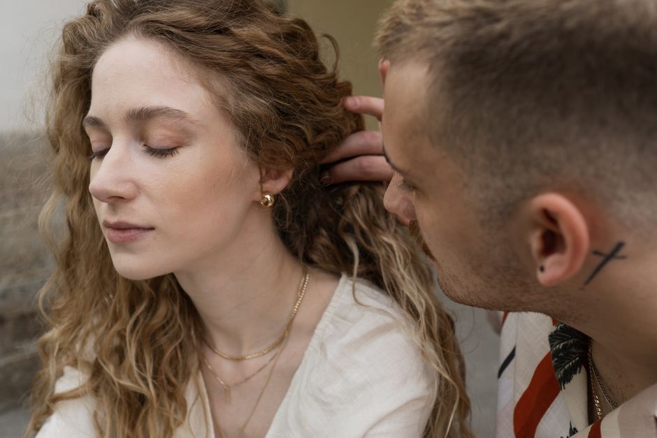 A tender close-up of a couple sharing an intimate moment, highlighting affection and connection.