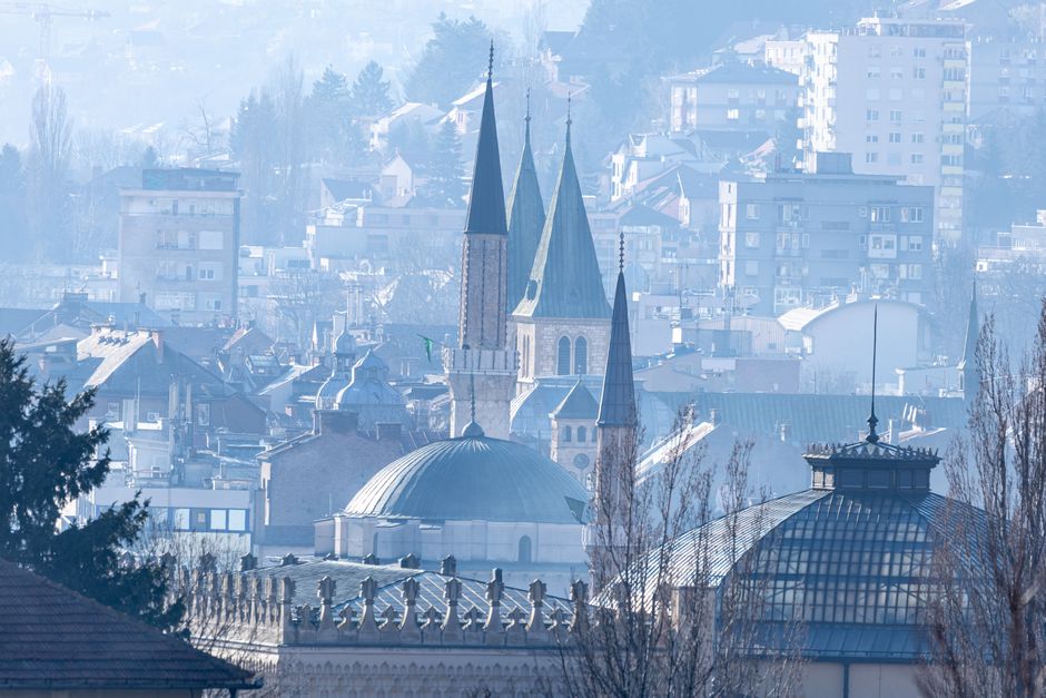 Aerial view of Sarajevo's historic architecture with cathedral spires.